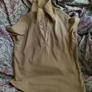 A medium “wild love” light brown cropped shirt.